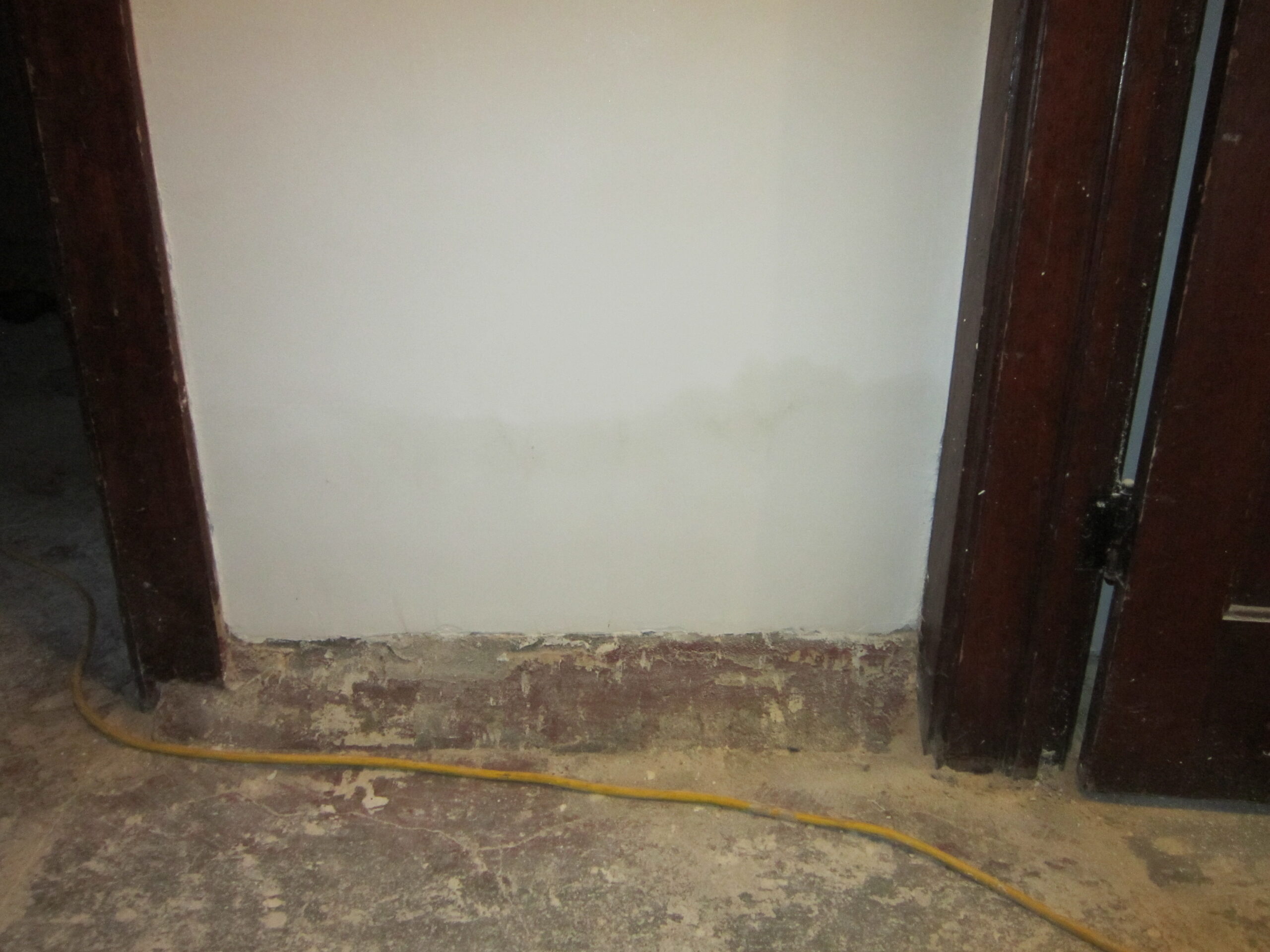 crumbling basement wall after