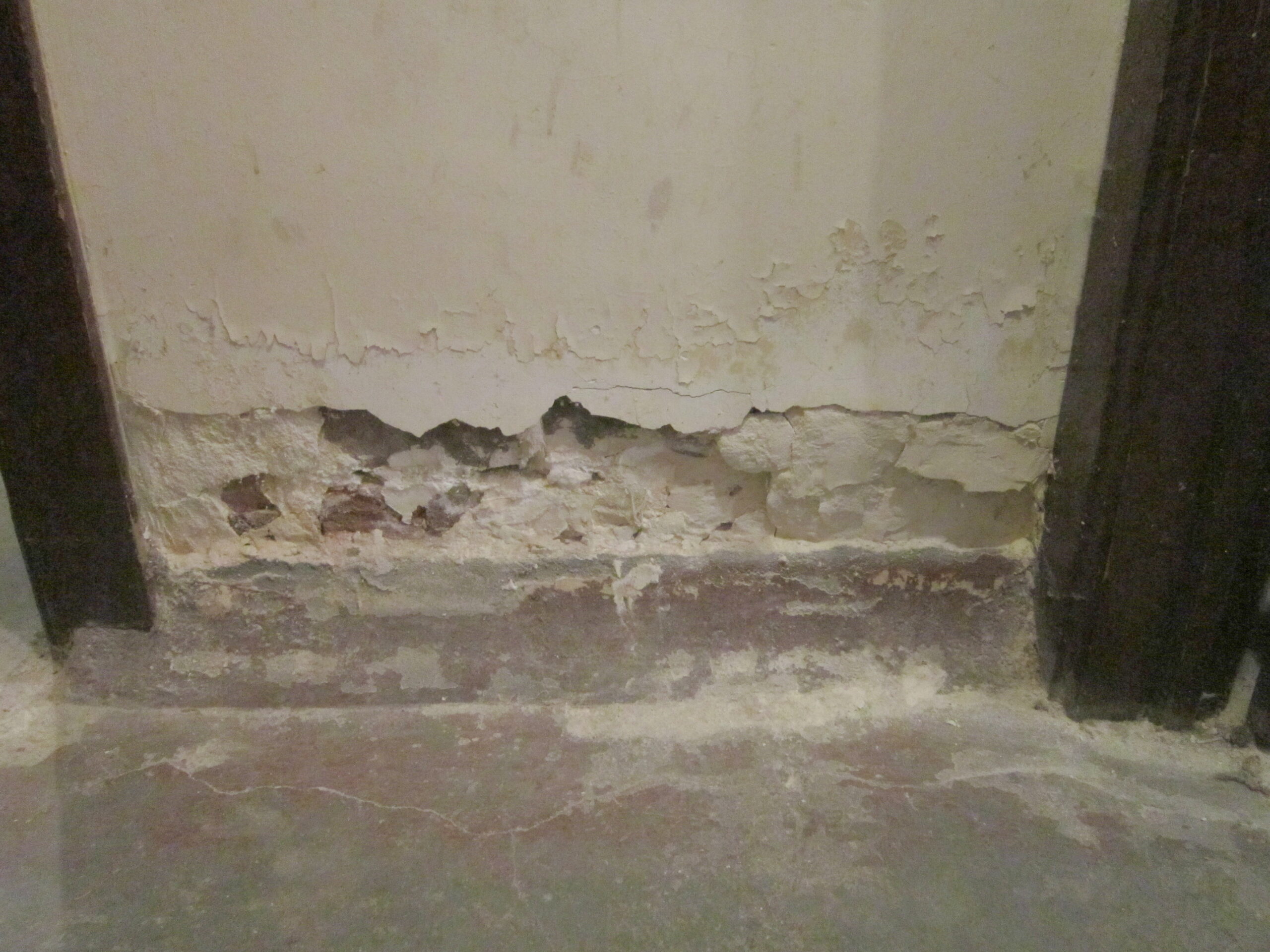 crumbling basement wall before