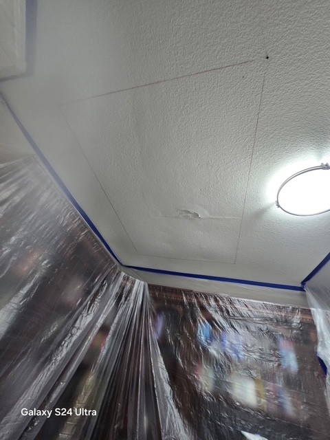 water damaged drywall on a ceiling